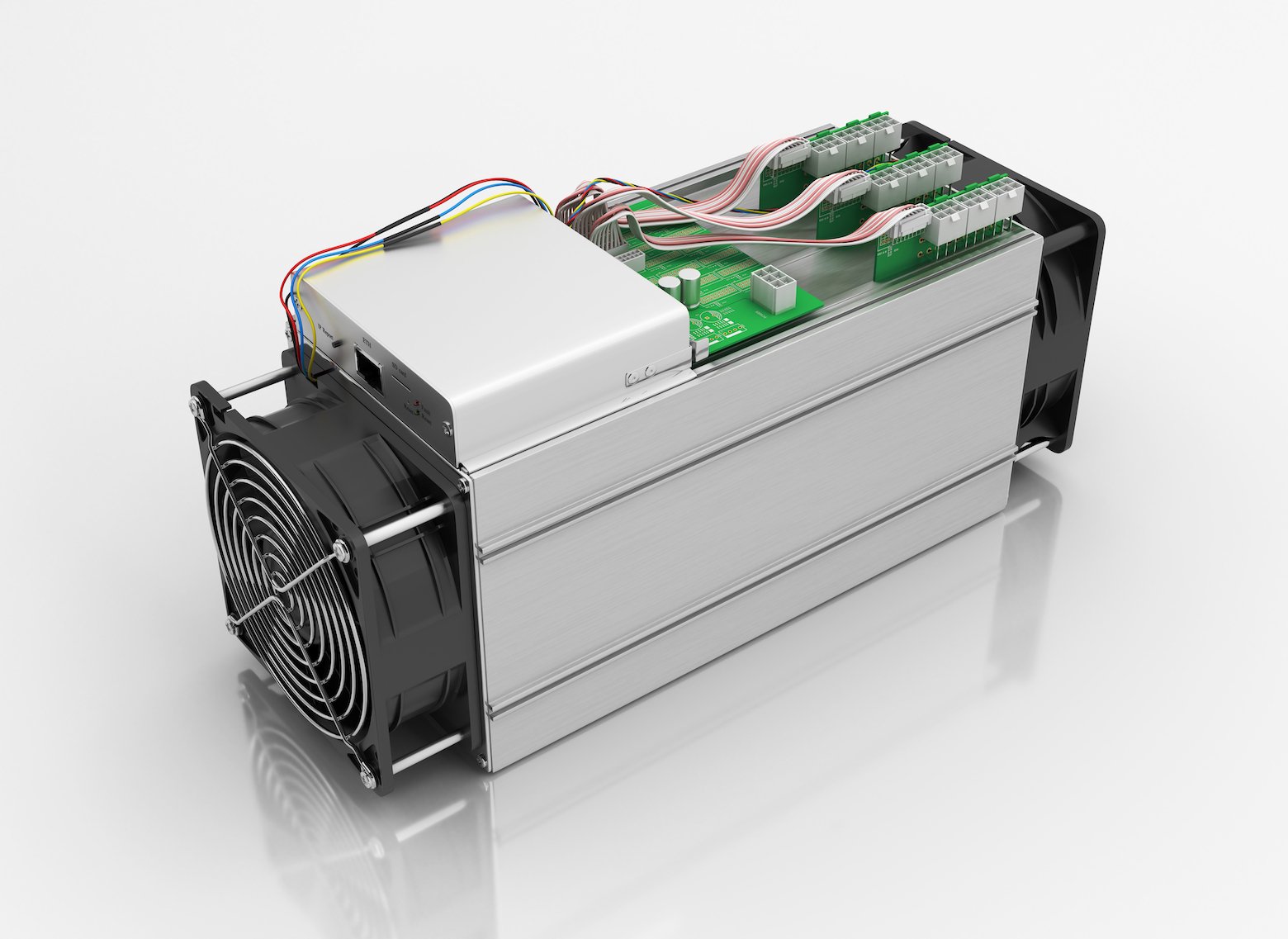 TAn ASIC miner in its white rectangular box with a large fan visible on the front end.
