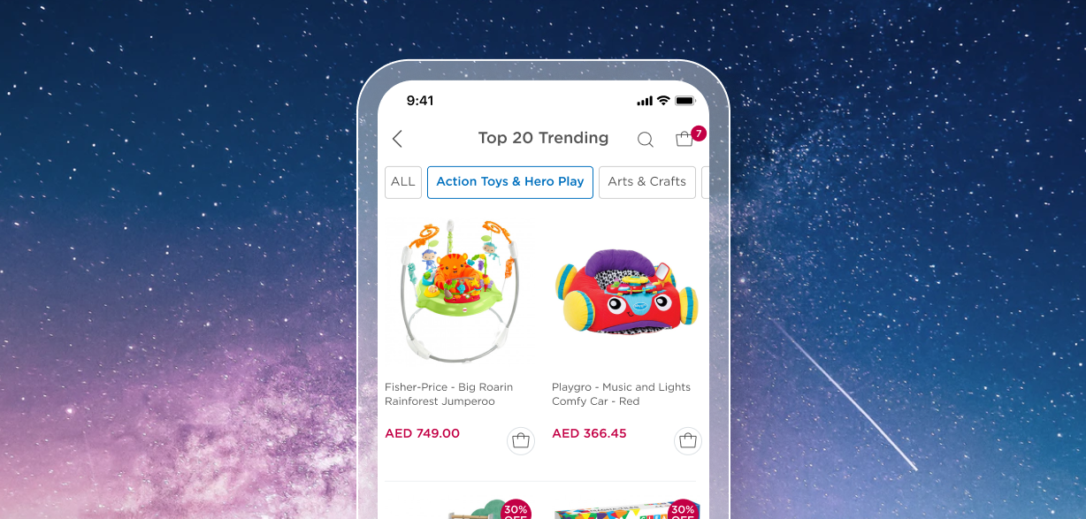 An image of an app’s standardized category filtering. At the top of the screen, it reads “Top 20 Trending.” Below the title are category filters that are outlined in blue when selected. The categories shown on the screen are “All,” “Action Toys and Hero Play,” and “Arts and Crafts.” Below the filters are photos of two toy products with their prices. The products are “Fisher-Price - Big Roarin Rainforest Jumperoo” and “Playgro - Music and Lights Comfy Car - Red.”