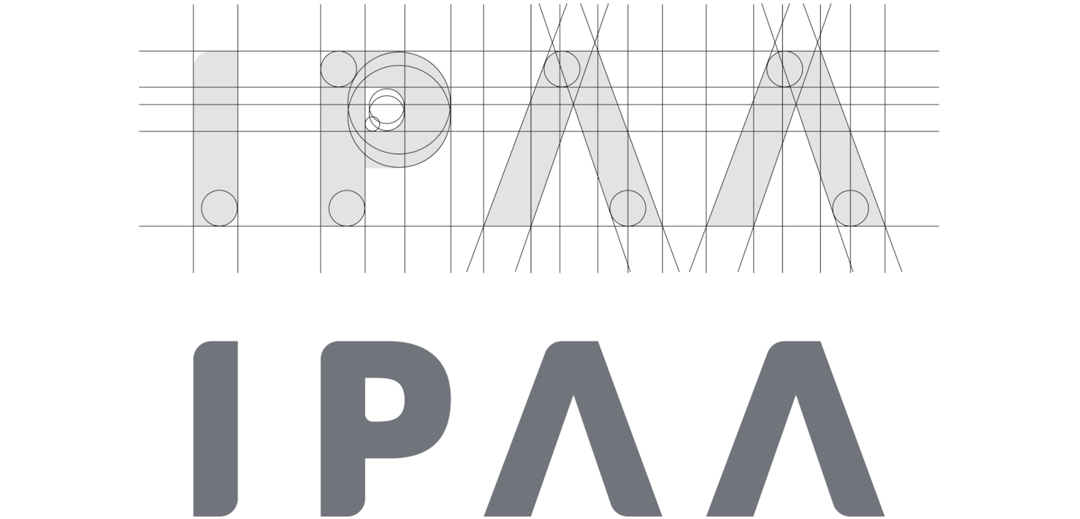 A diagram showing the proportional lines, angles, and curves that inform the design of the custom logotype. The letters IPAA are rendered first in "blueprint" form and then in the logo's final opaque form. 