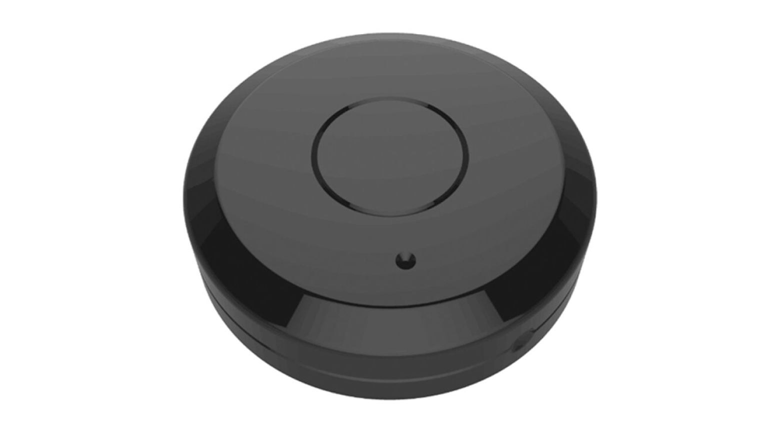 A photograph of a black puck-shaped device.