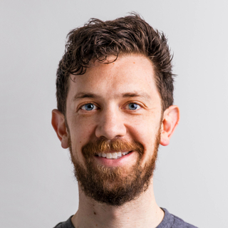 Jake Kahana, Senior InDesign Designer.