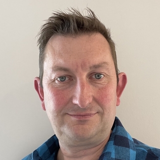 Christopher Reid, Toptal Nuxt.js Developer.