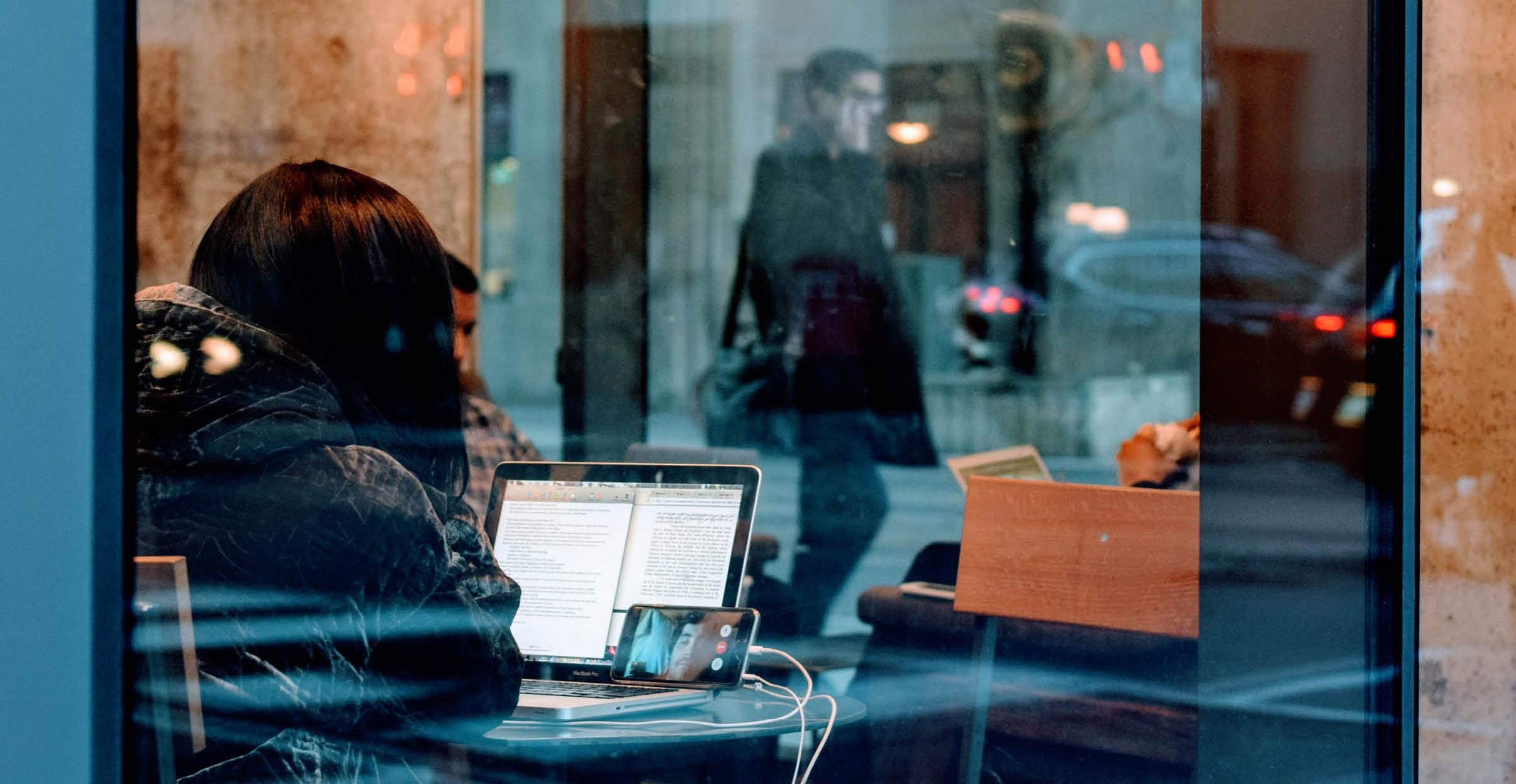 Digital nomad lifestyle freelance designer working at the cafe.