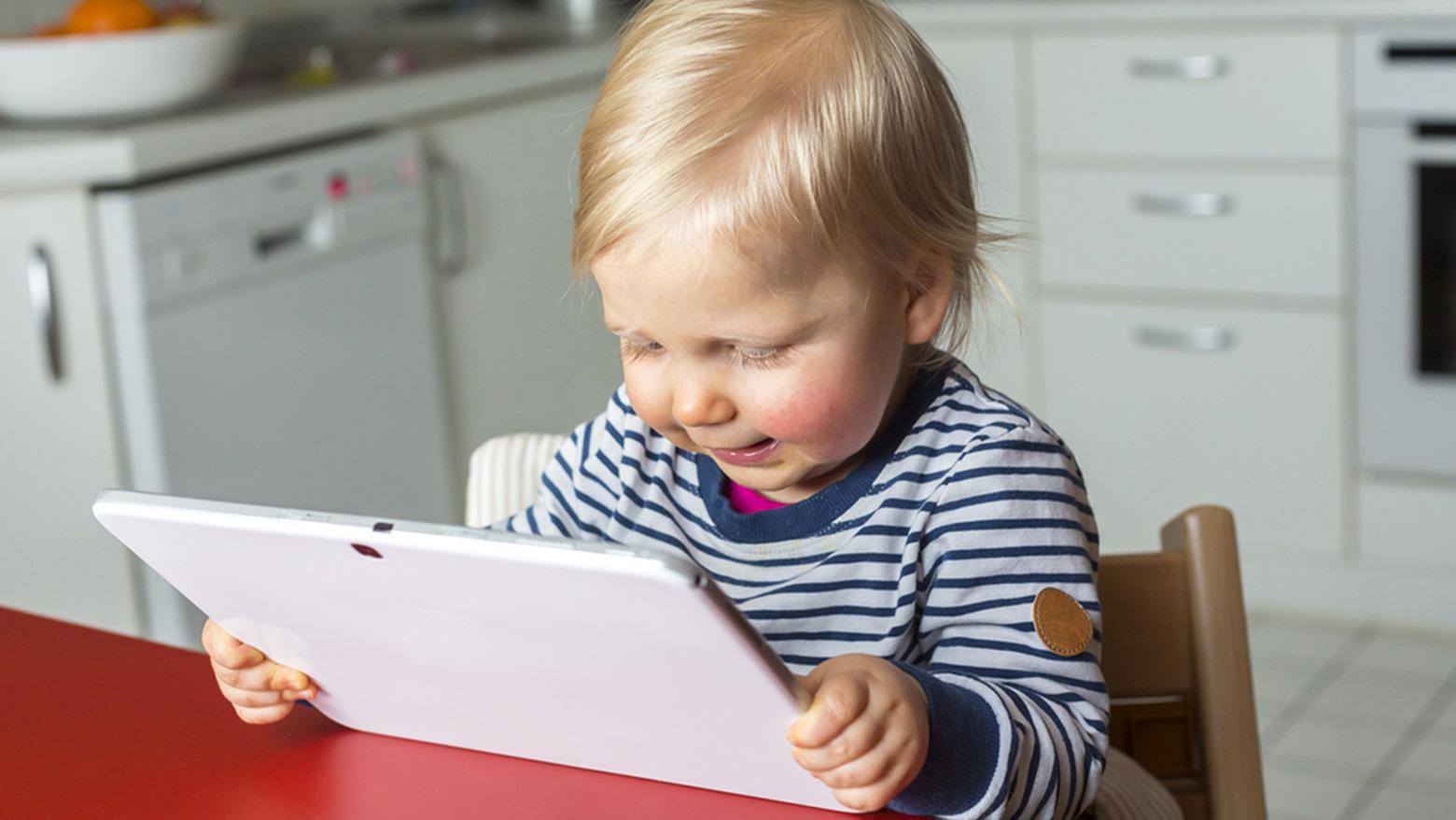 UI design history and a baby with a tablet