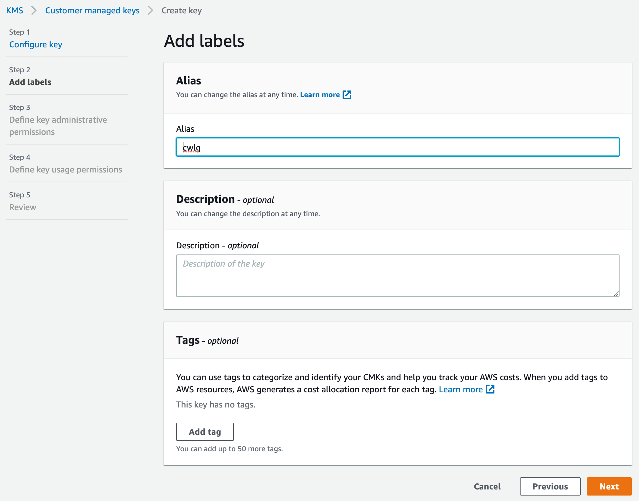A screenshot of AWS with the same breadcrumbs, now at Step 2: "Add labels." An Alias field is set to "cwlg," an optional Description field is left blank, and an optional Tags field has no tags added.