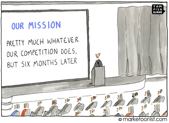 A cartoon depiction of a conference room where the speaker is displaying a slide with a useless mission statement. It says, "Our mission: Pretty much whatever our competition does, but six months later."