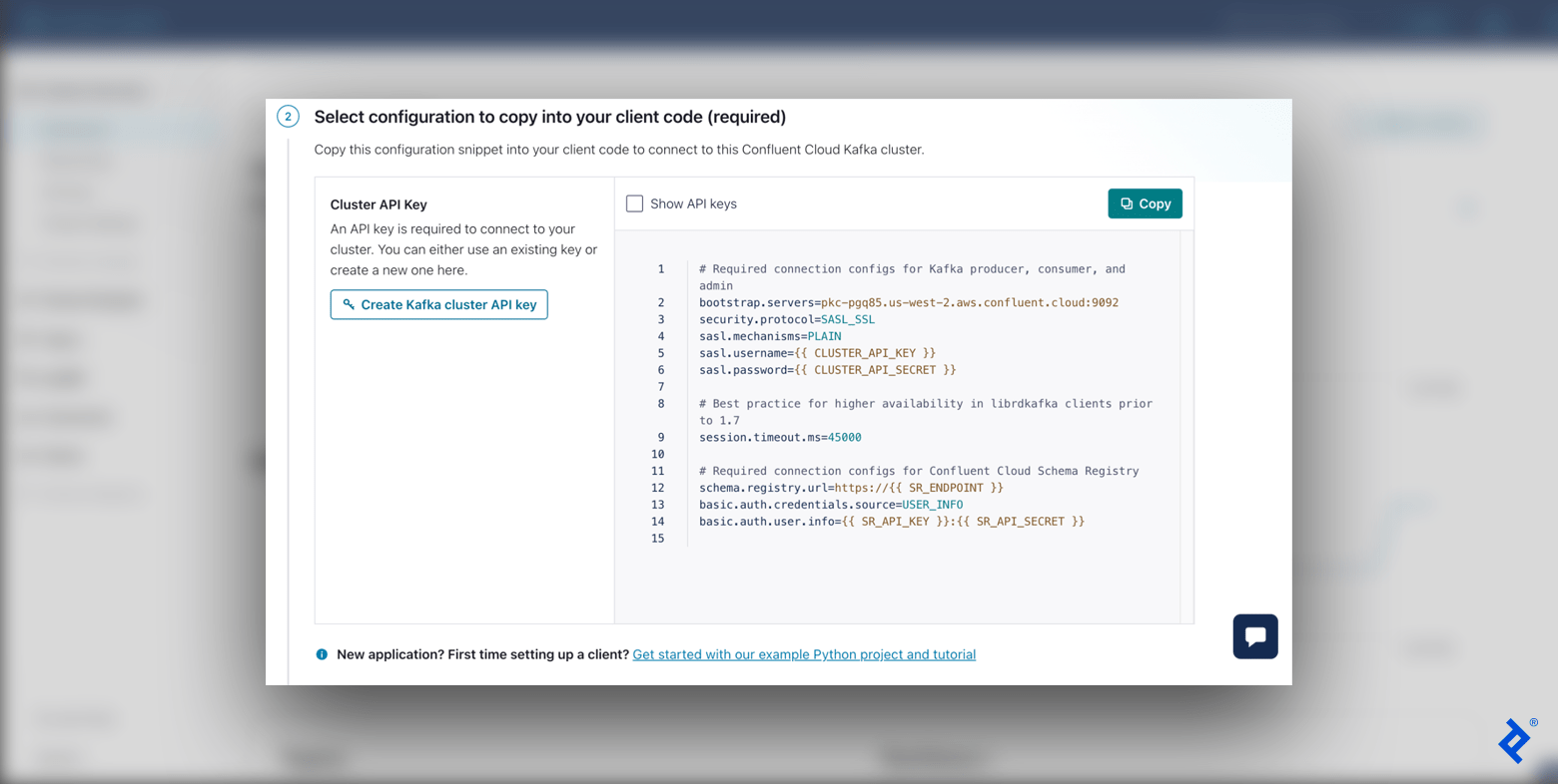 The Confluent Clients screen showing step 2 (client code configuration) with the Kafka cluster API key setup and the configuration code snippet.
